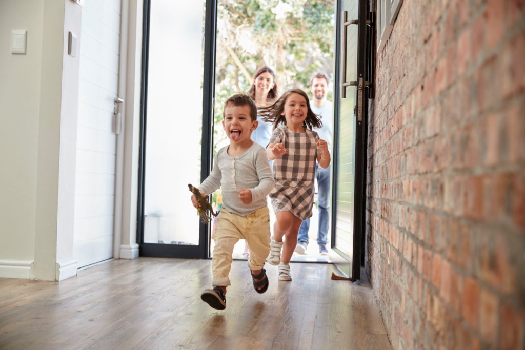 Young family returning to a safe and secure home